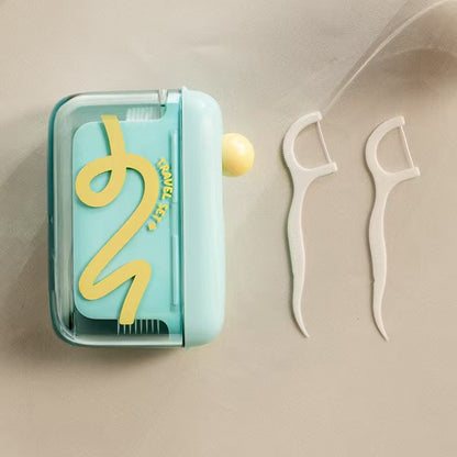 Automatisk popup-dispenser for tanntråd