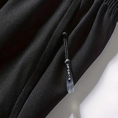 🏆 Meilleure Vente 2026 | Treningsshorts med hurtigtørkende teknologi | Glidelåslommer for nødvendigheter 📱💨【-48%】