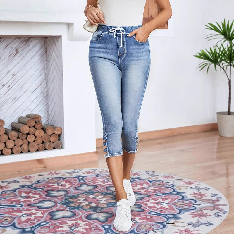 Stretchiga caprijeans för damer med dragsko i midja