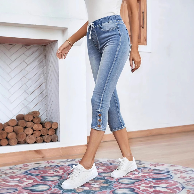 Stretchiga caprijeans för damer med dragsko i midja