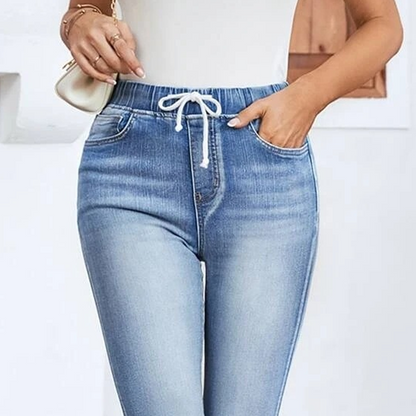 Stretchiga caprijeans för damer med dragsko i midja